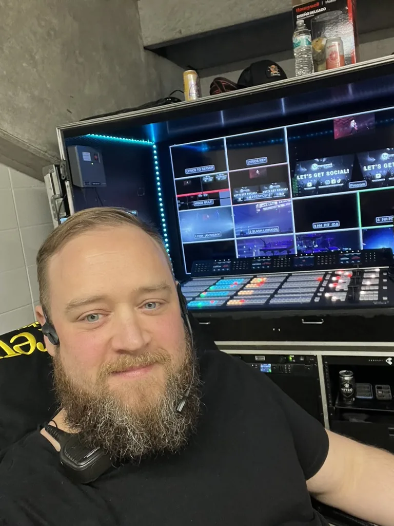 Jesse Maitland on headset at the switcher